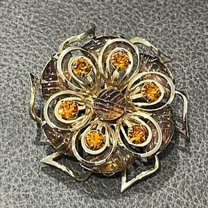 Amber colored flower costume brooch